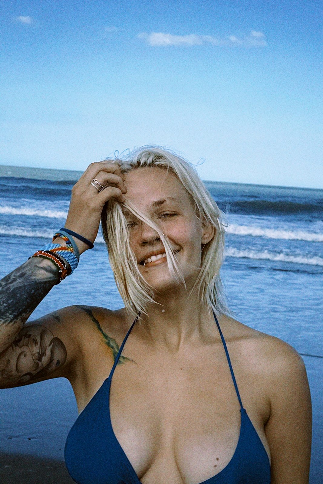Daria smiling by the ocean